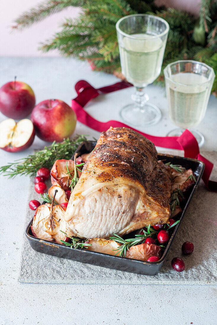 Roast pork with apples and cranberries for Christmas