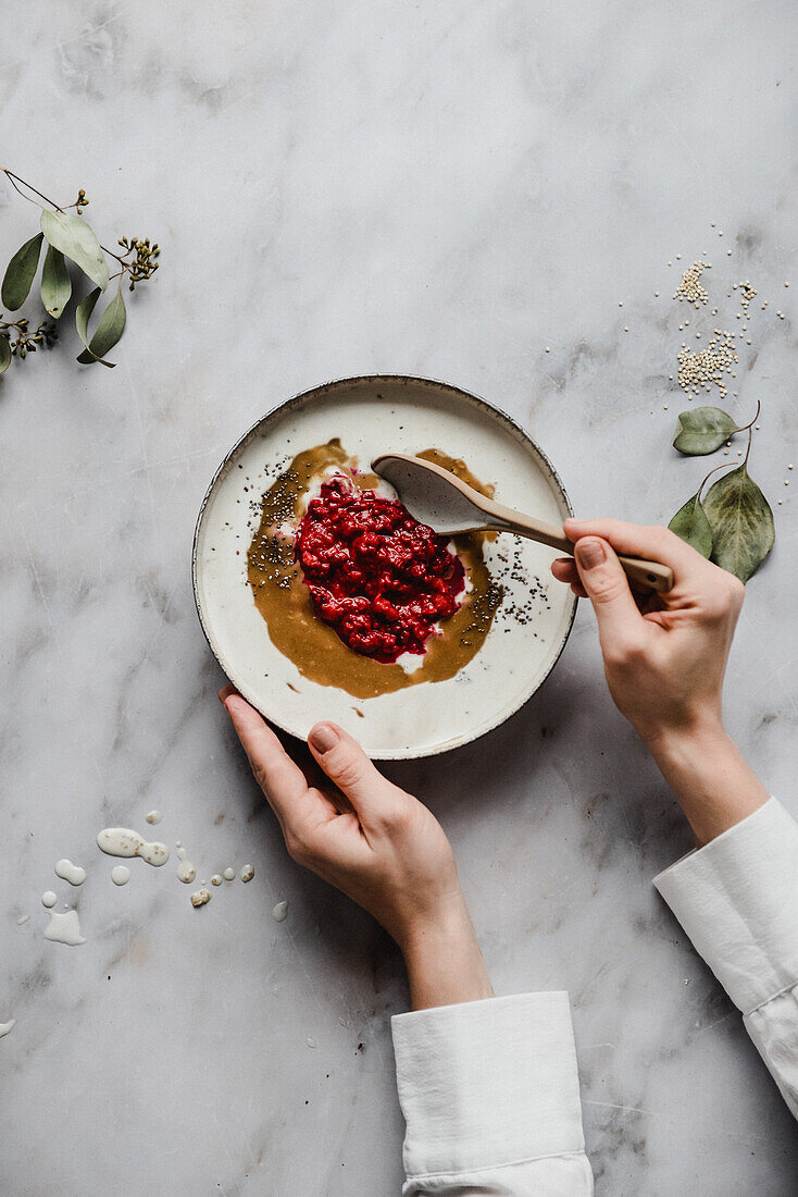 Oatmeal with milk, raspberries and peanut butter