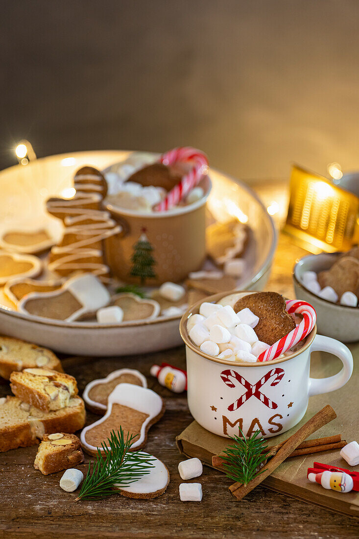 Assorted Christmas cookies and a mug of hot chocolate with marshmallows