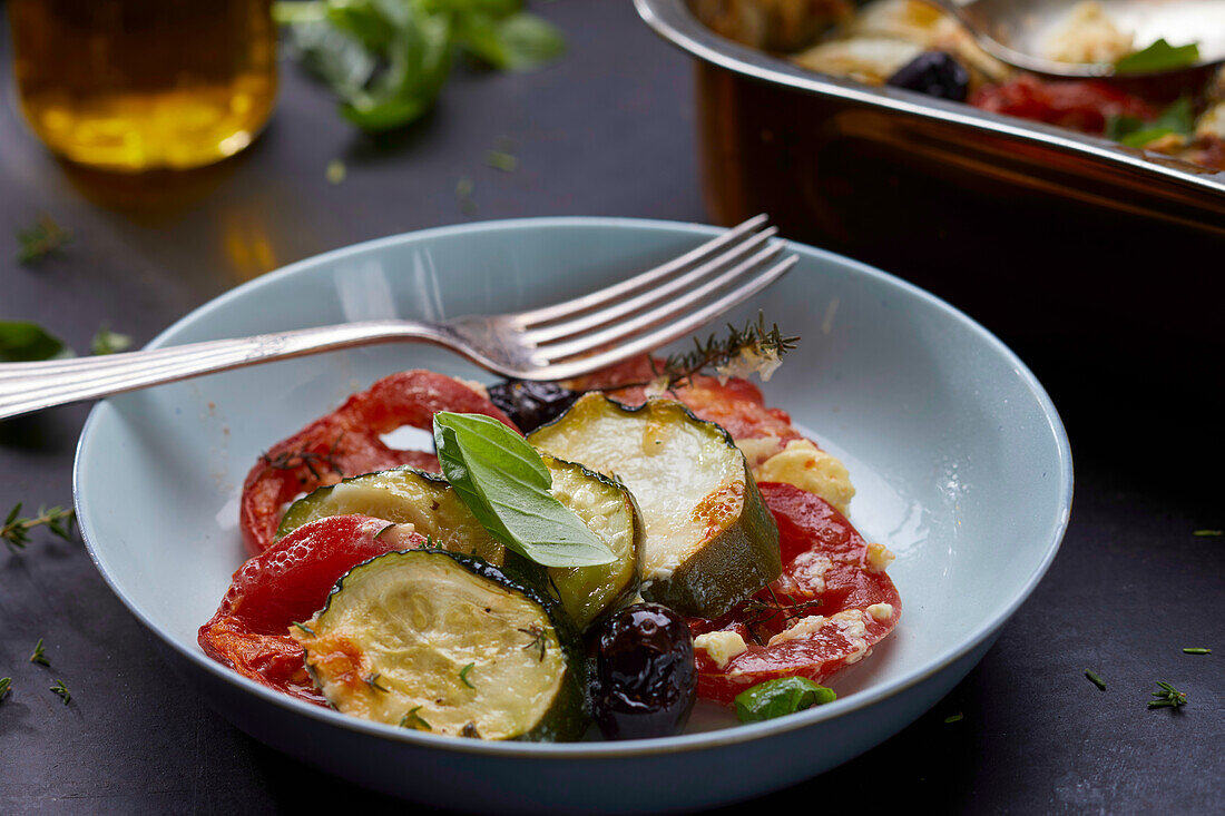 Scooping Vegetable Casserole with Tomatoes, Zucchini and Summer Squash