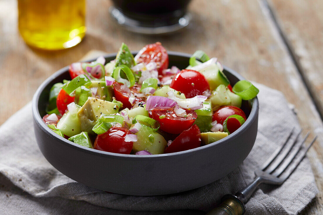 Vegetable salad with tomatoes, cucumber, and avocado