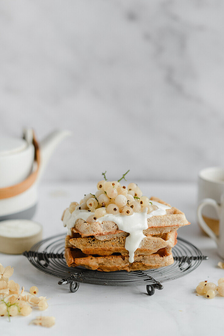 Buckwheat waffles with coconut cream and white currant