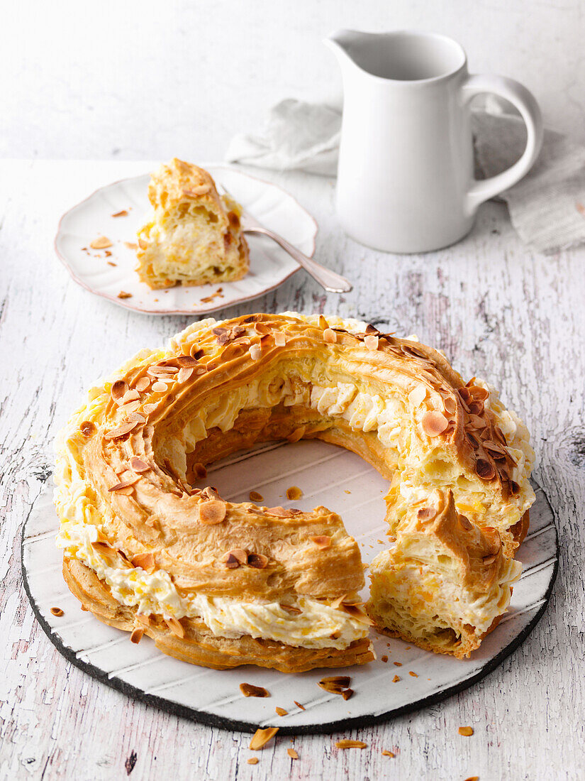 Choux pastry wreath with apple cream and almonds