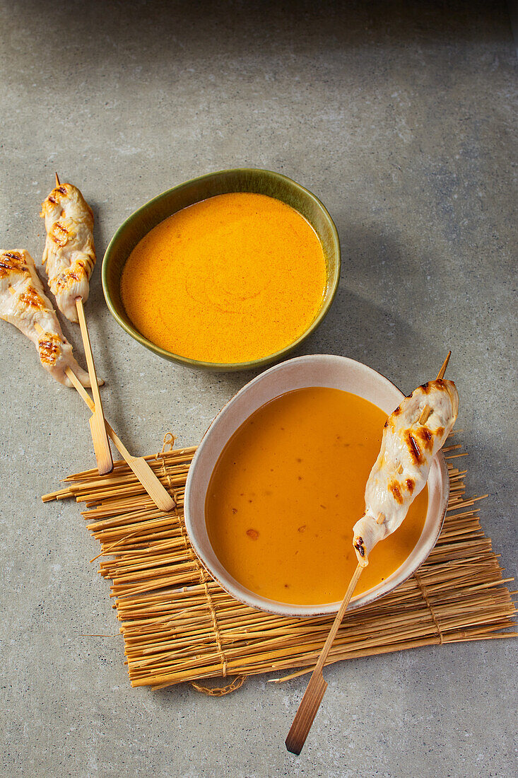 Curry sauce and satay sauce for chicken skewers