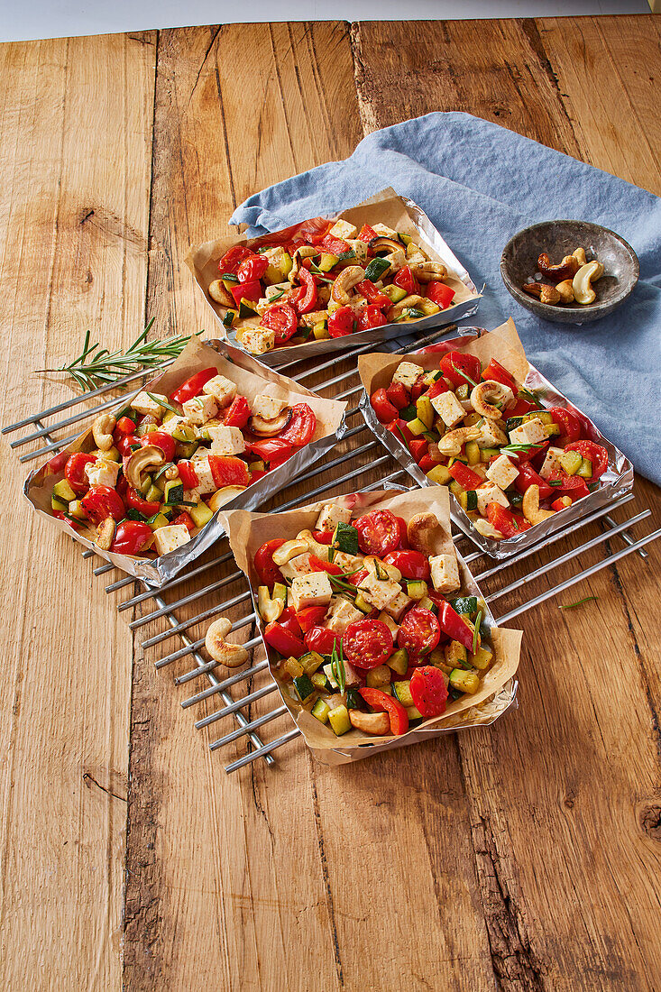 Sheep cheese and grilled vegetables in paper dishes