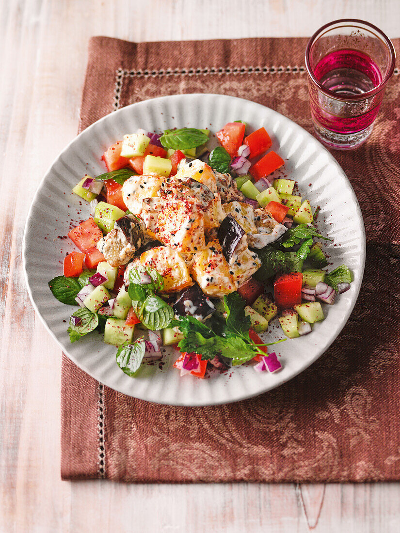 Oriental potato salad with cucumber, tomato, and mint