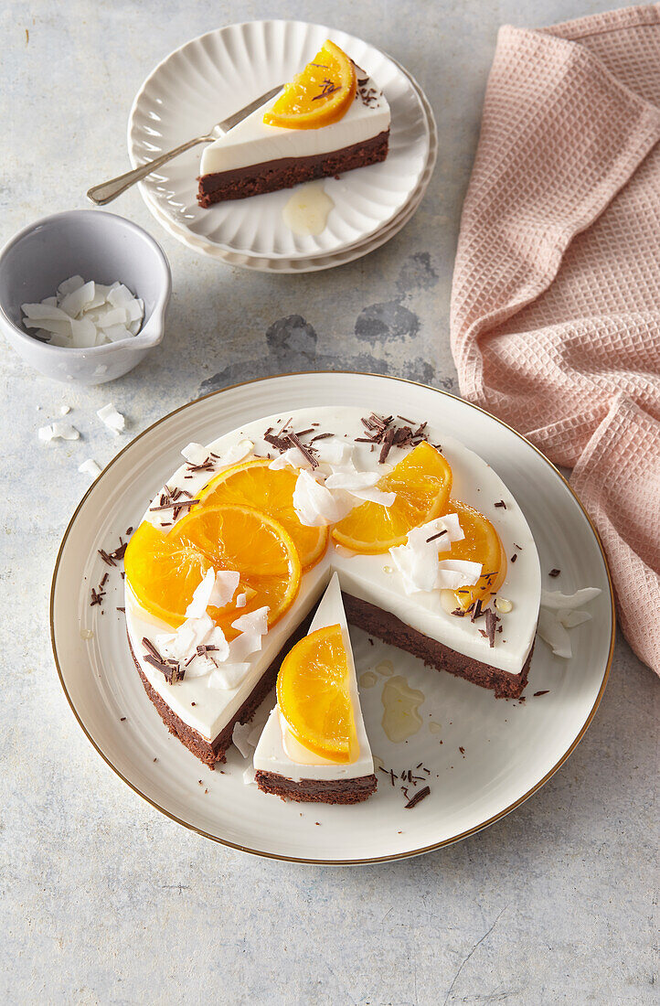 Cream cheese cake with oranges and coconut chips