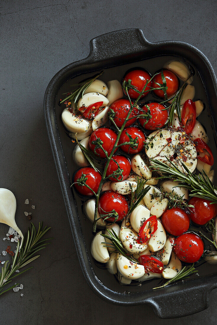 Prepare oven roasted garlic and cherry tomato confit