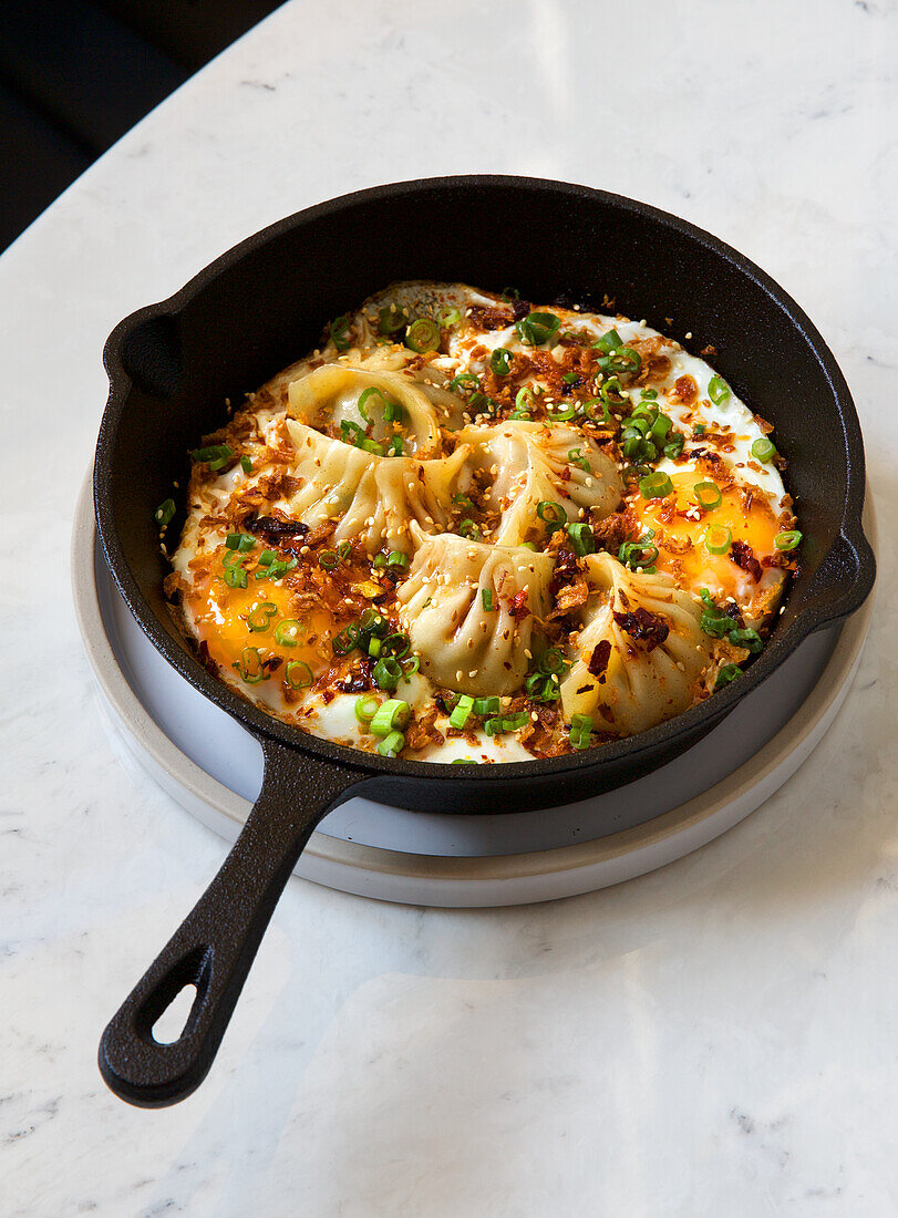 Chinese dumplings with fried eggs from the pan