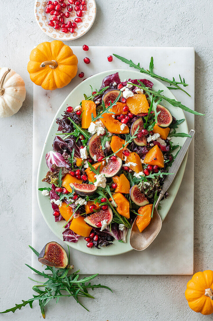 Fig salad with pumpkin and pomegranate seeds