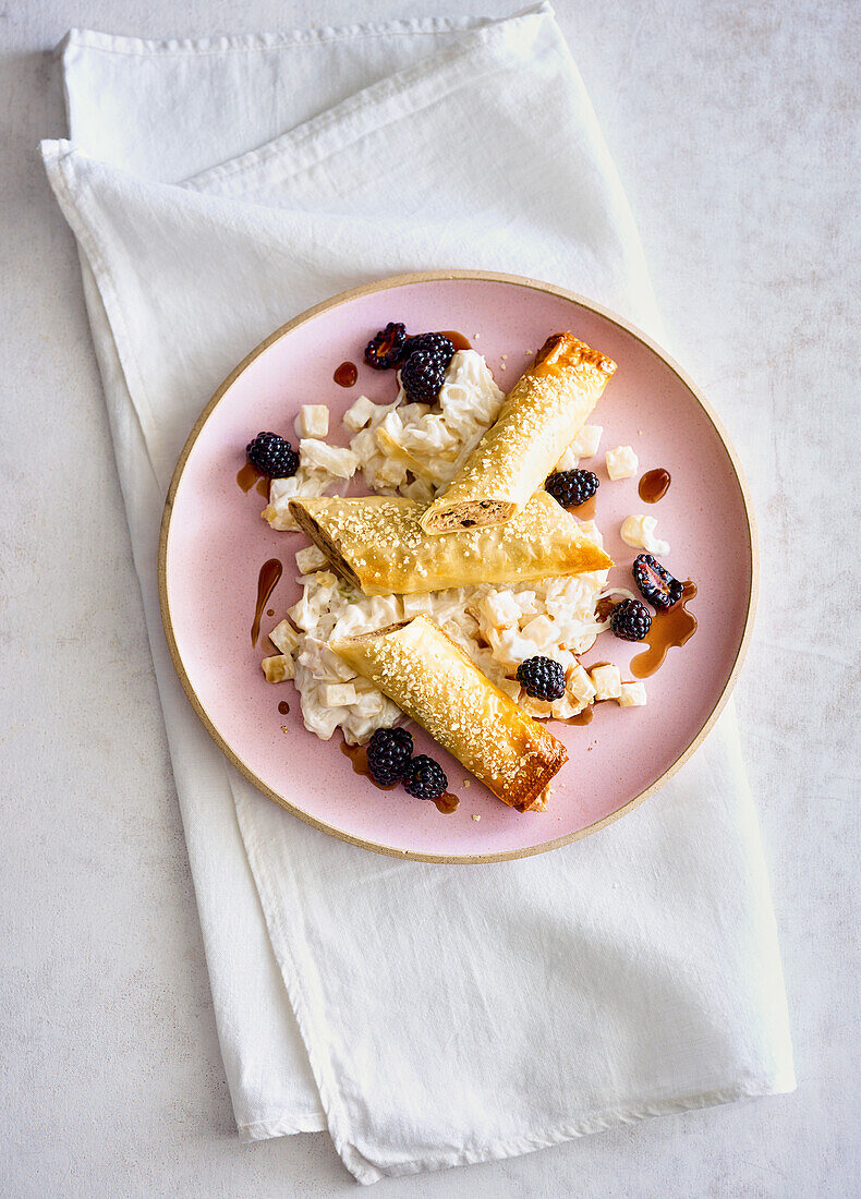 Walnut-goat cheese strudel with celeriac and blackberry dressing