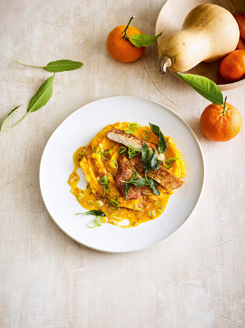 Chicken with pumpkin mash and mandarin leek sauce