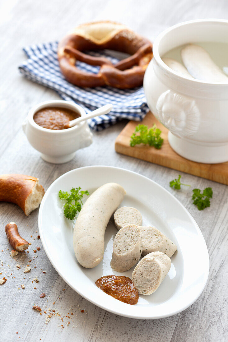 White sausage with sweet mustard and pretzel