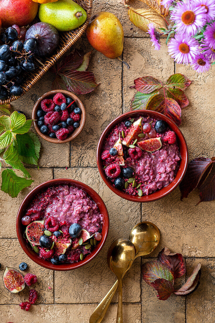 Porridge with raspberries, blueberries, and figs