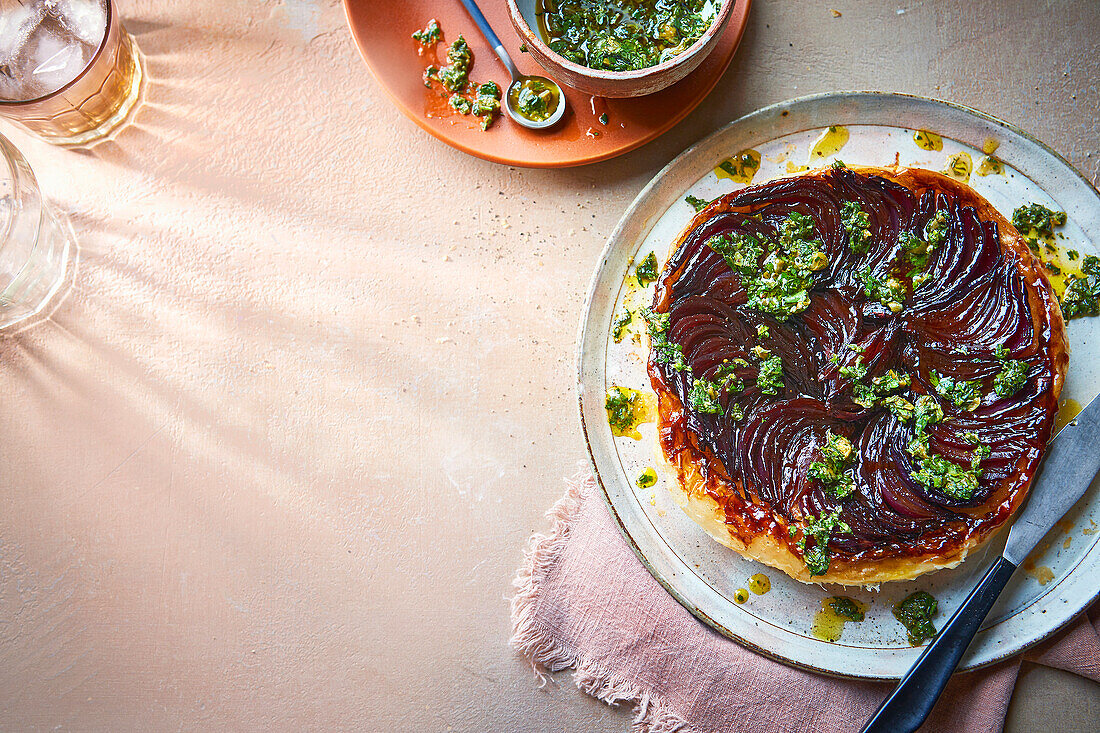 Tarte Tatin with red onions and strong salsa verde