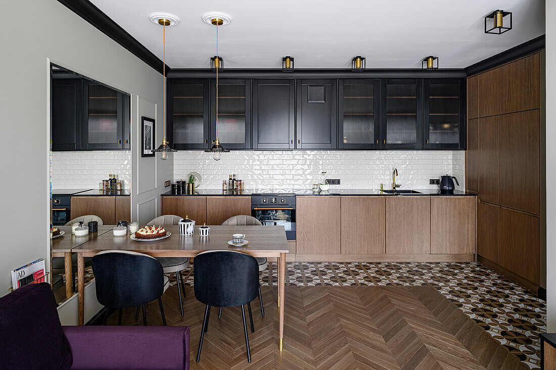 Open plan living room with fitted kitchen, dining area, and dark purple sofa