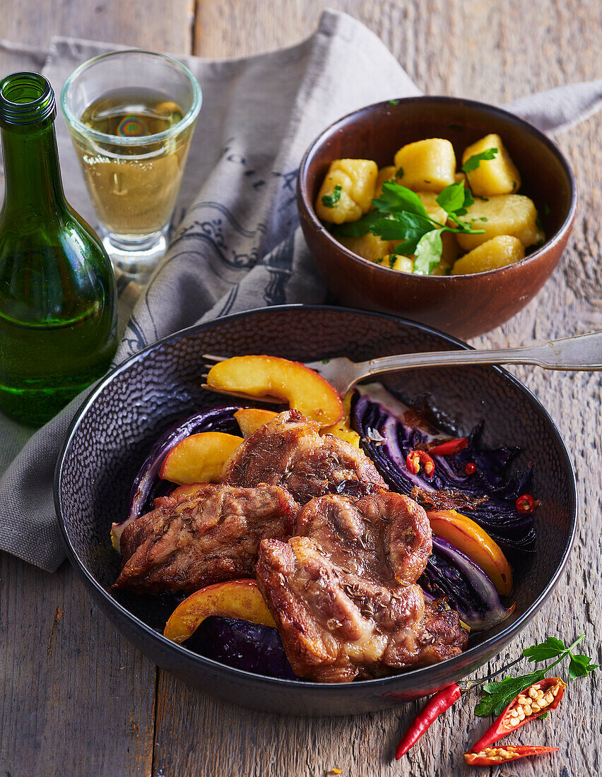 Pork neck and braised red cabbage with apples