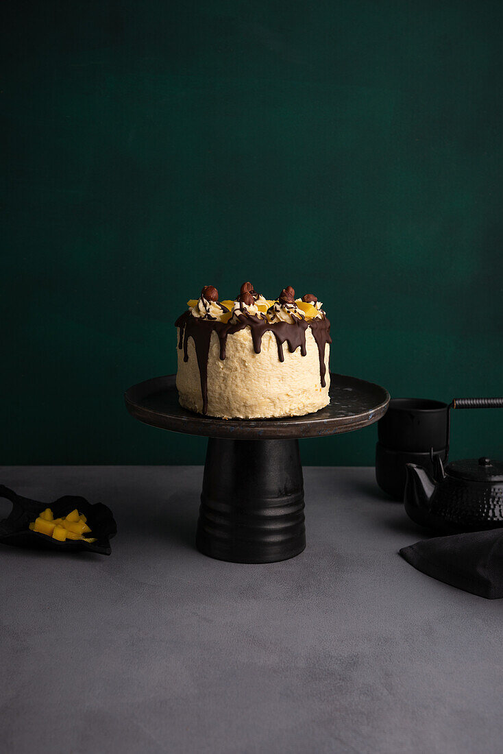 Vegan mango buttercream cake with nuts