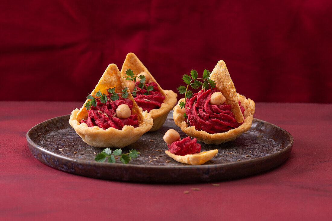 Beetroot cream with tortilla chips in shortcrust pastry bowls