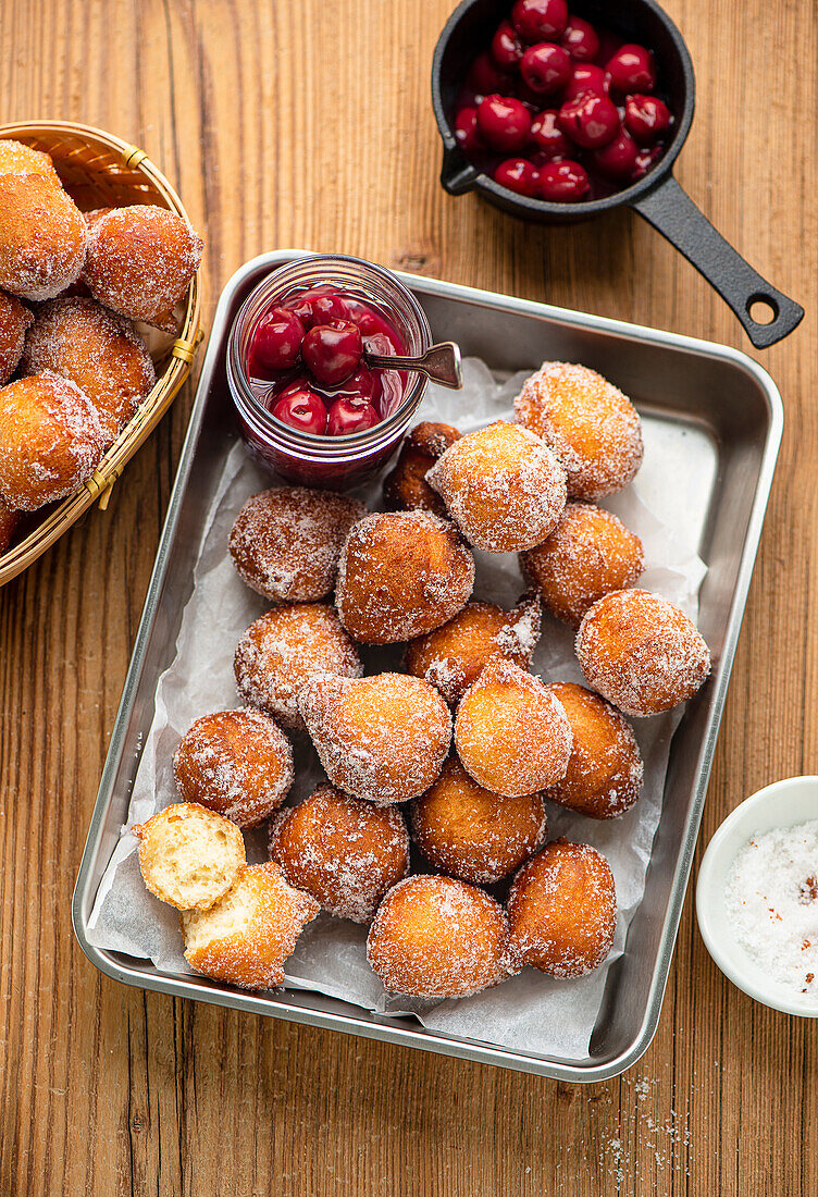 Buttermilk doughnuts holes with cherry compote