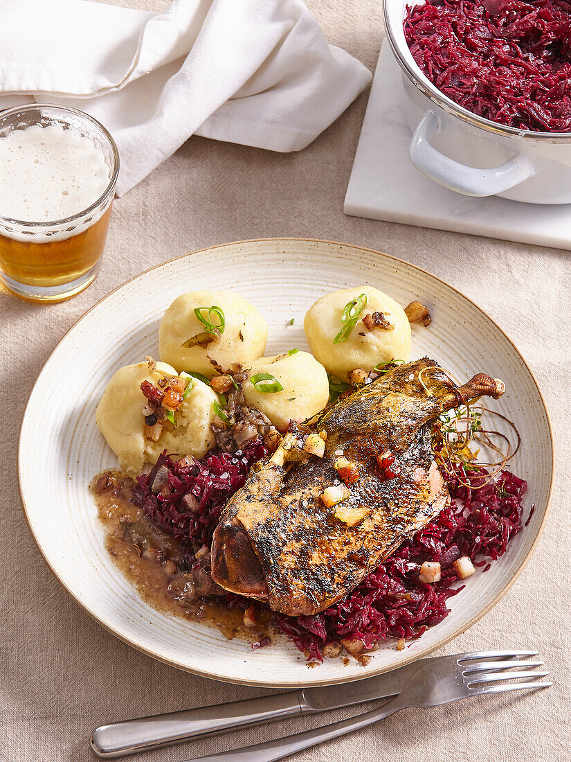 Roasted wild duck with red cabbage and dumplings