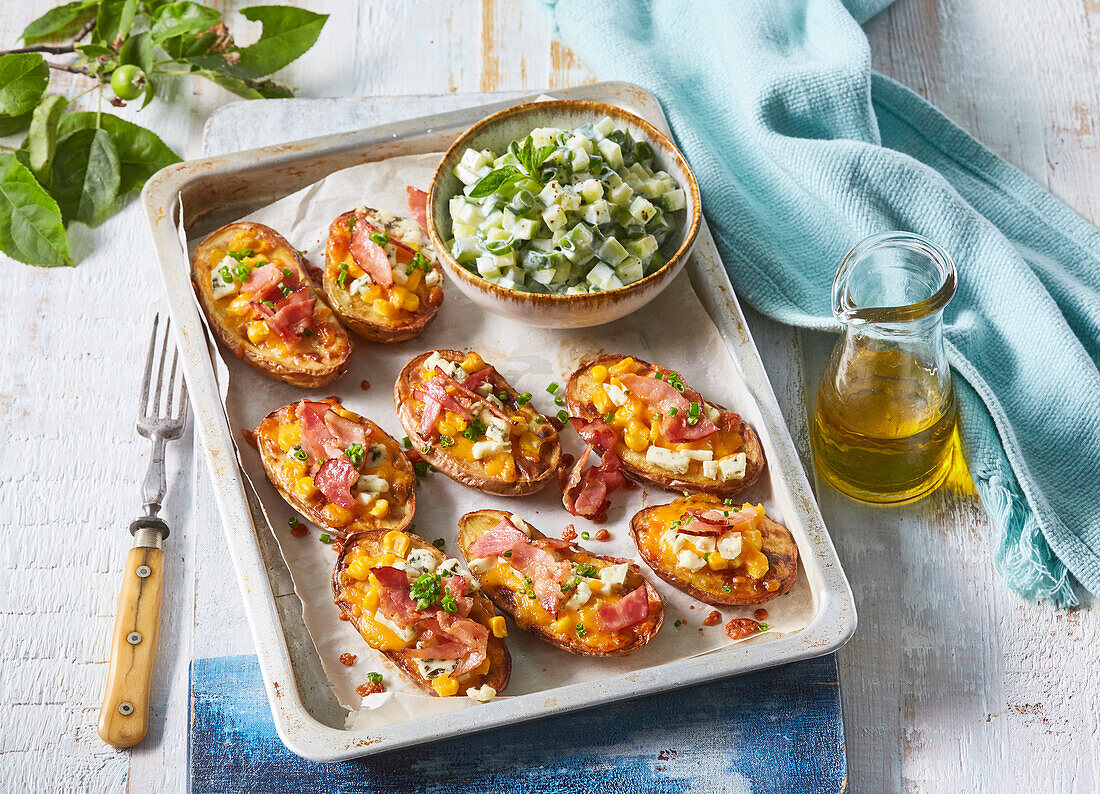 Baked potato halves with cucumber salad