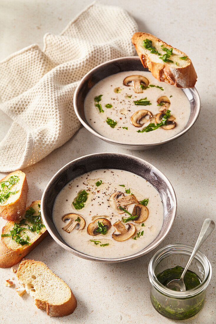 Creamy mushroom soup with herb butter crostini