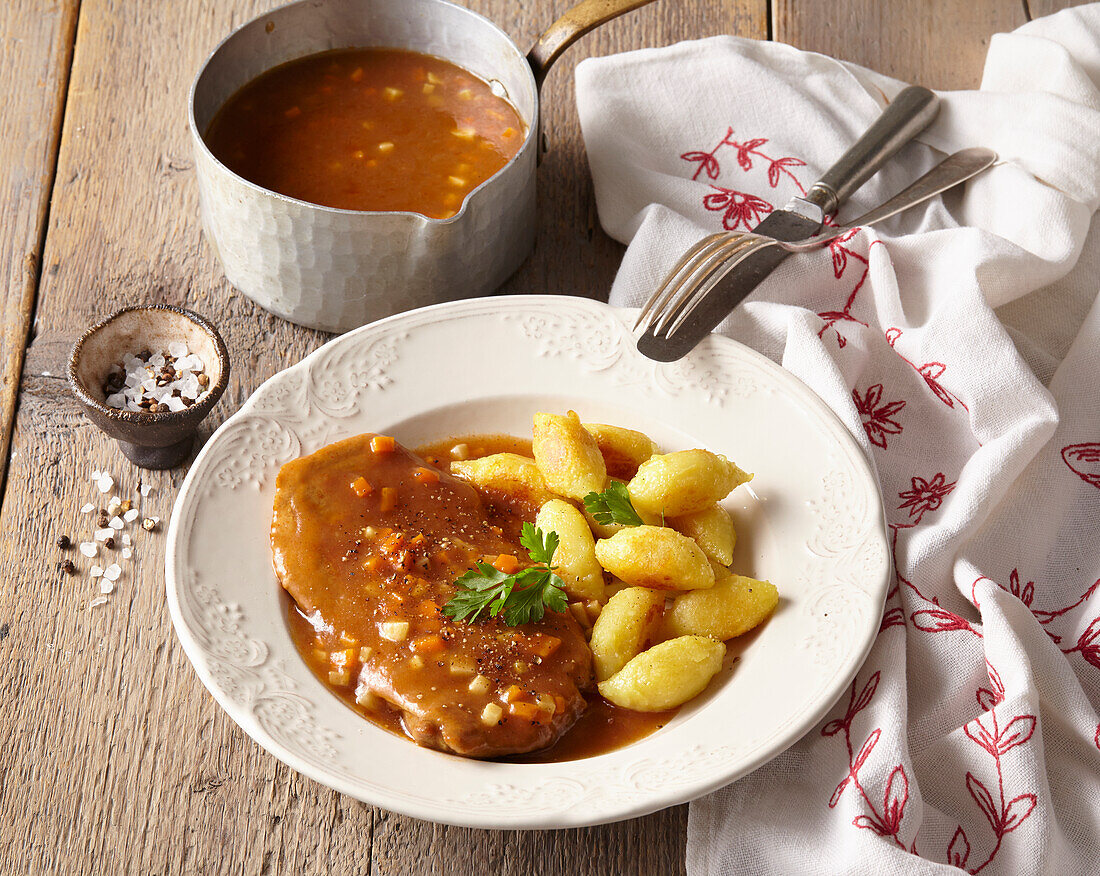 Pork neck with gingerbread sauce and semolina gnocchi