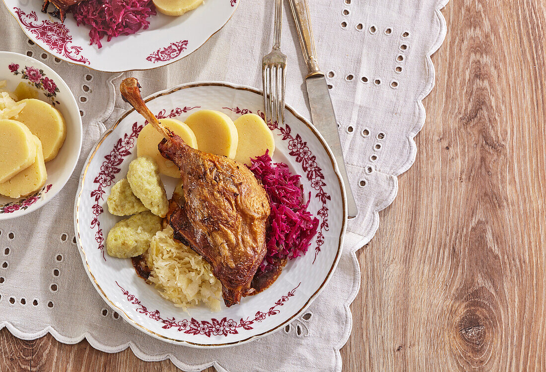 Roast goose leg with two kinds of cabbage and dumplings