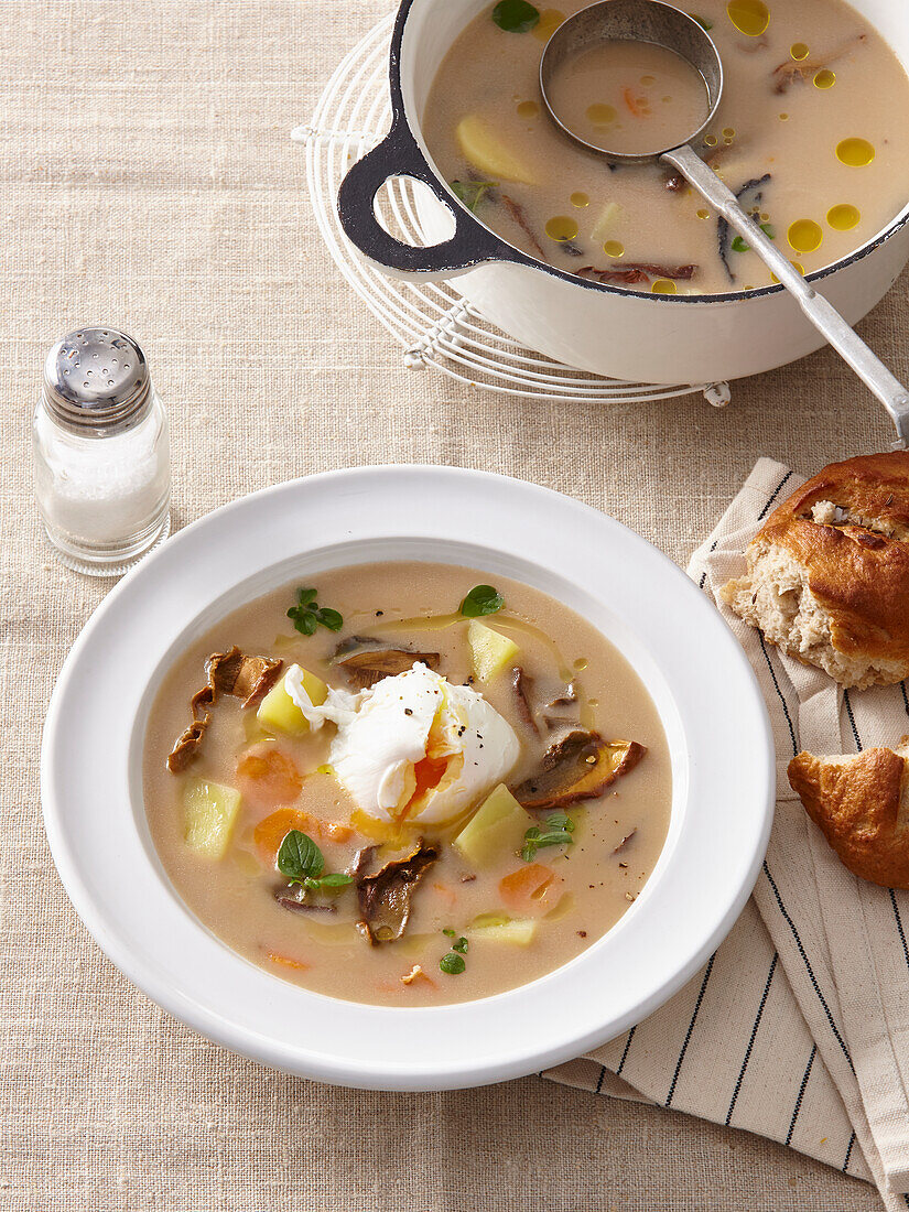 Sour potato soup with poached eggs