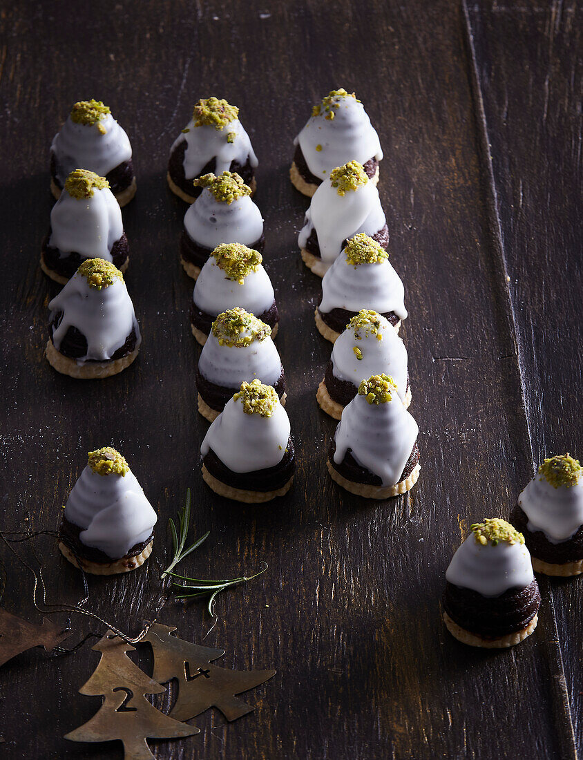 Christmas tree cookies with chocolate and pistachios