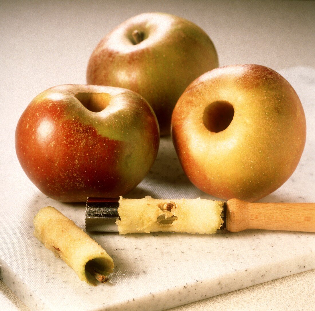 Preparing baked apples: coring the apples