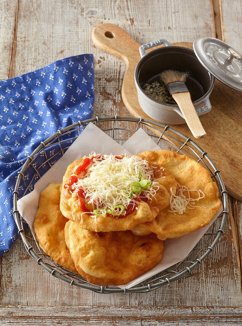 Langosh - Hungarian fried pastry with cheese