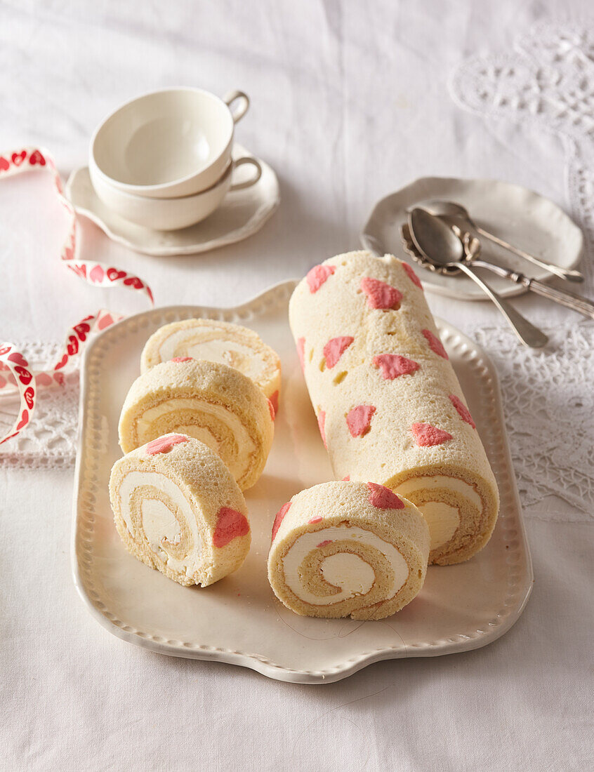 Mascarpone sponge cake roll with heart motif