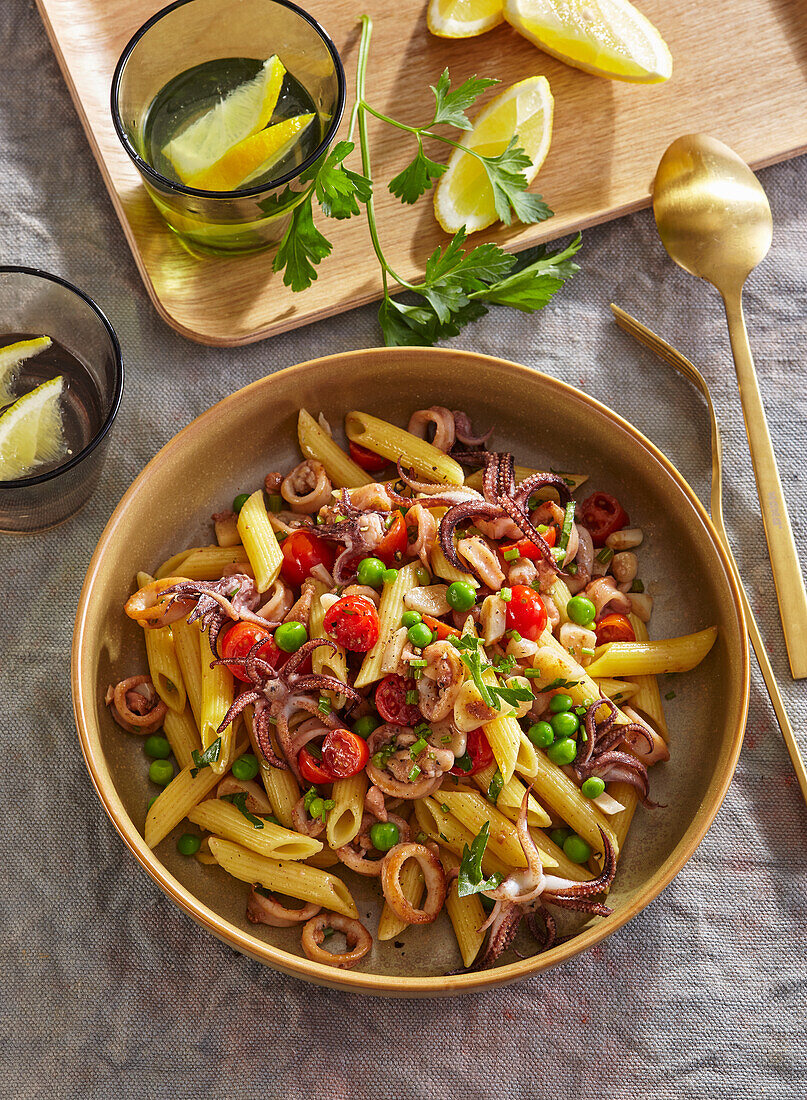 Penne with calamari, peas, and tomatoes