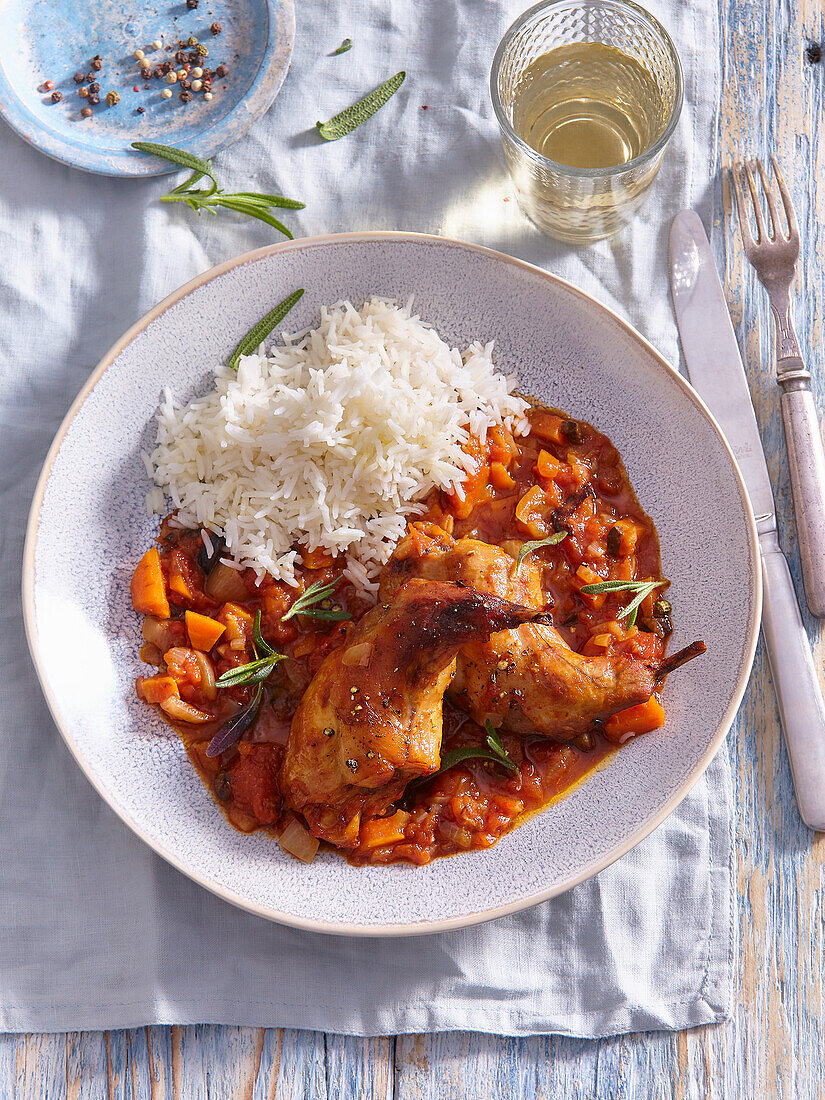 Spanish rabbit in tomato sauce with rice