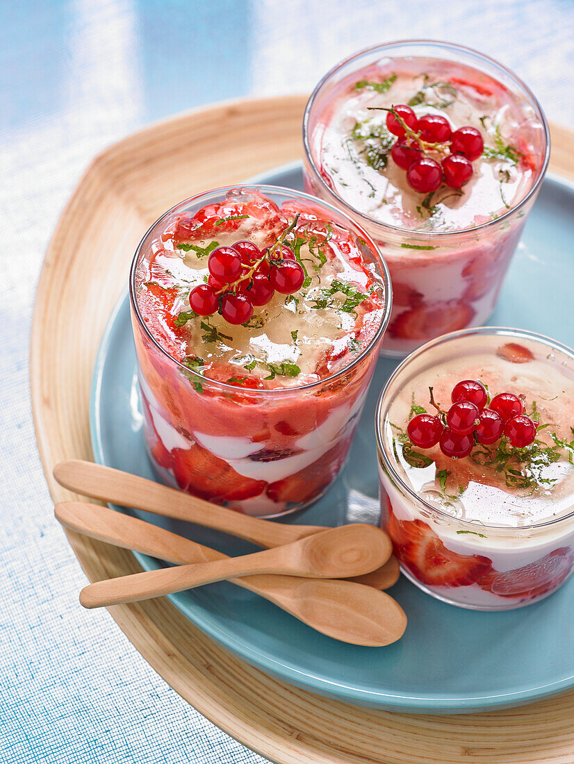 Layered dessert with cream with red fruit