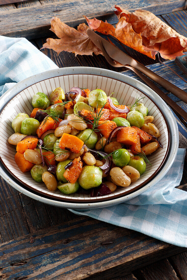 Autumn vegetable dish with brussels sprouts, pumpkin and beans