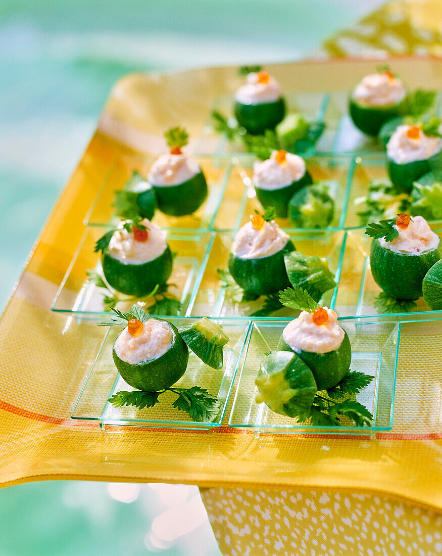 Mini round zucchini with fish cream and salmon caviar