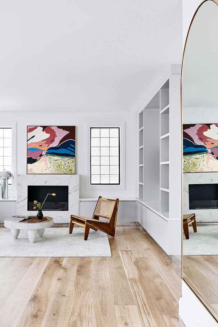 80s style living room with coffee table and replica designer chair in front of fireplace