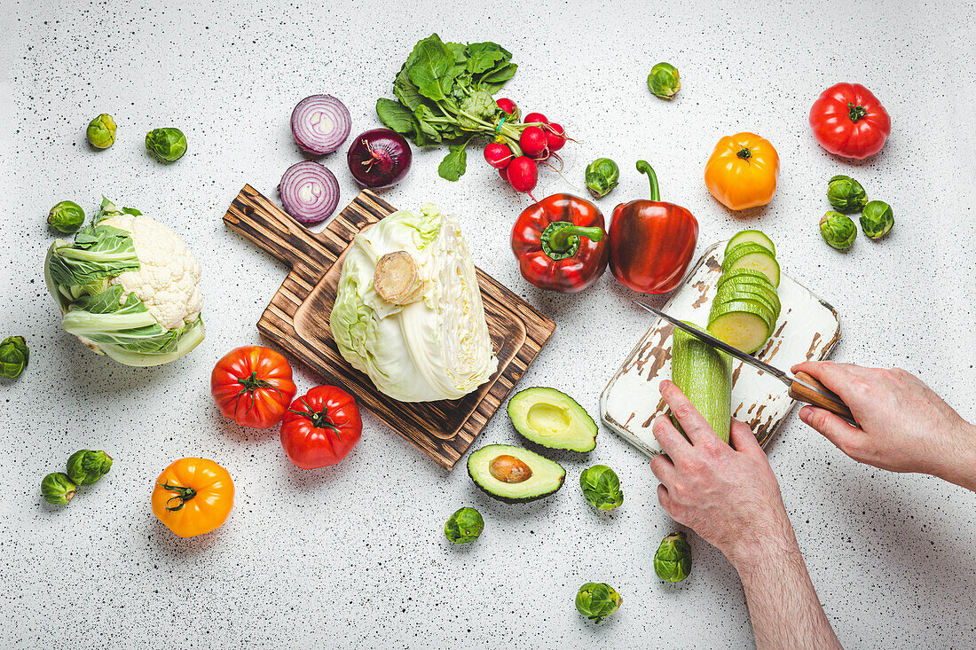 Slicing fresh vegetables on wooden cutting boards