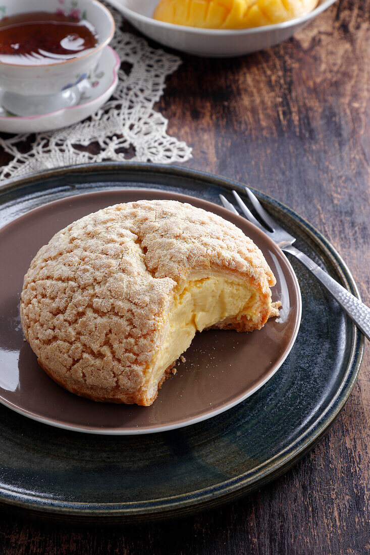 Choux Craquelin with mango cream filling