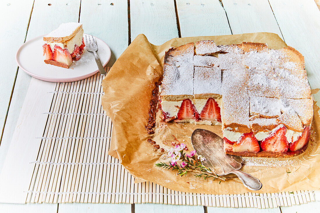 Strawberry tart with top crust and powdered sugar