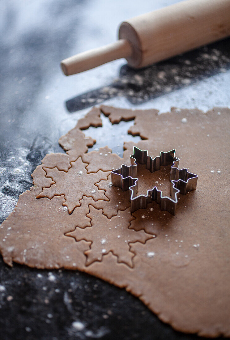 Cutting out gingerbread biscuits