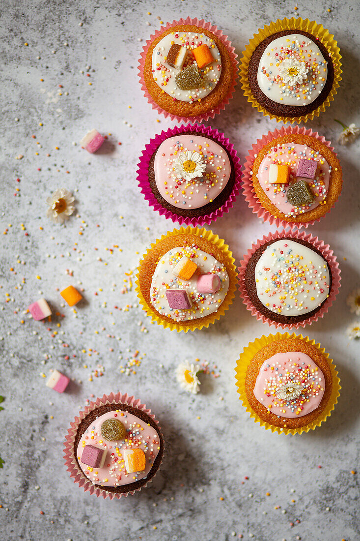 Fairy Cakes decorated with icing, sweets and love beads