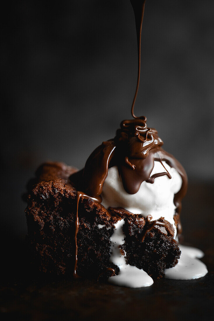 Chocolate brownie with ice cream and chocolate sauce