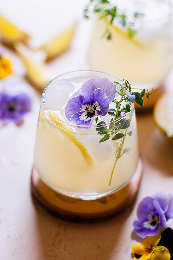Violet lemonade with thyme sprig