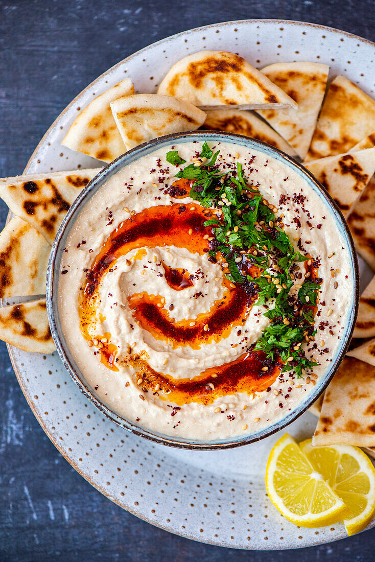 Hummus with spiced oil, parsley and sesame seeds