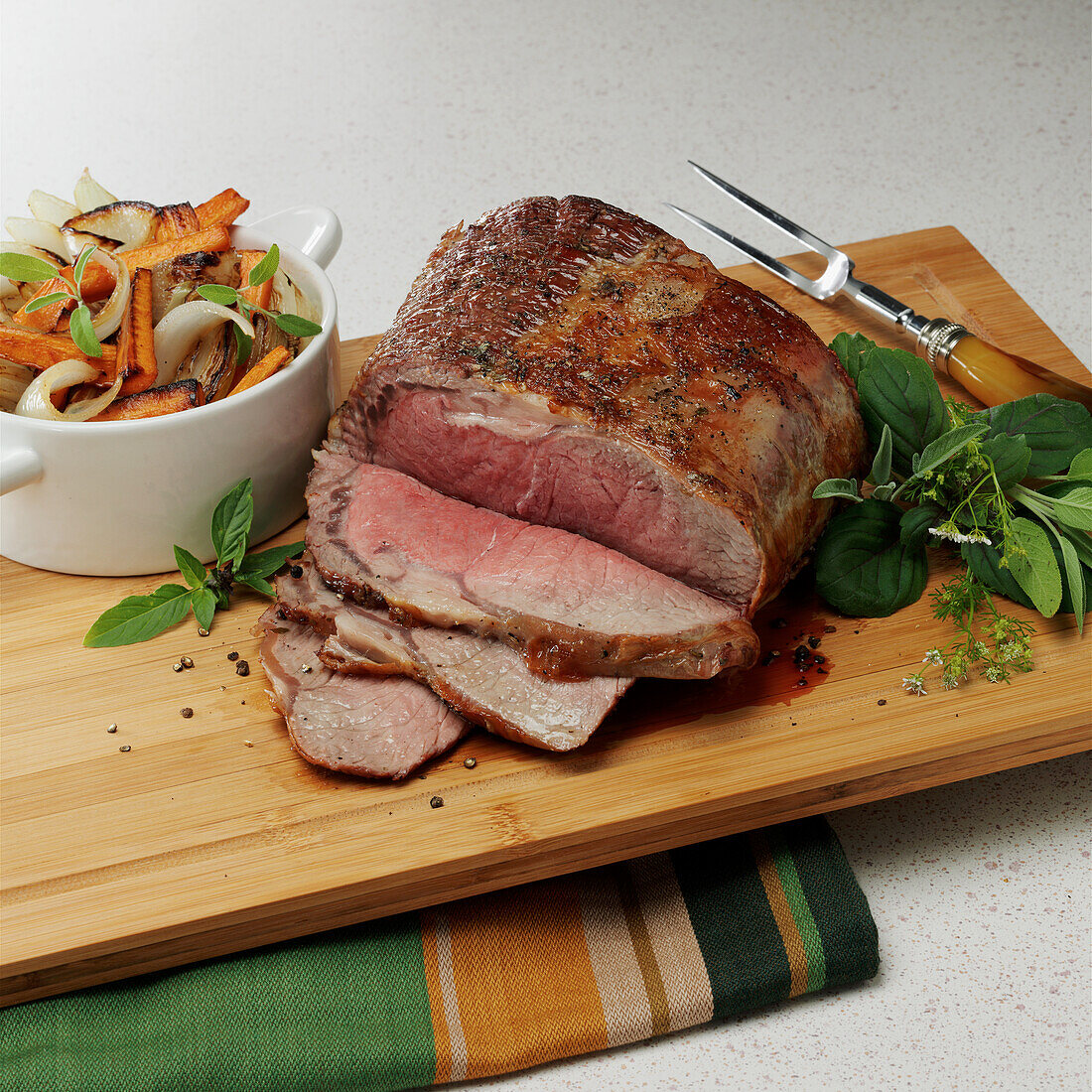 Roast beef with herbs and oven roasted vegetables