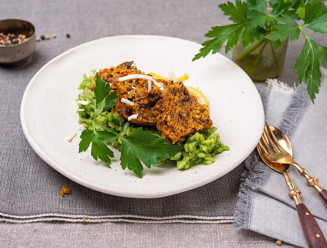 Vegan roast lentils on spinach risotto